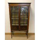 An Edwardian inlaid mahogany and painted decorated, two door china display cabinet,