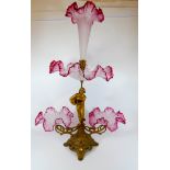 Late 19th century gilt metal and cranberry frilled glass table centre piece epergne with figural