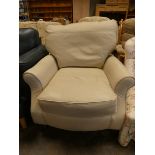 A modern easy chair in cream leather