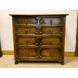 A Jacobean style oak chest of three long and two short drawers,