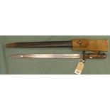 The Lee Enfield British bayonet in its leather scabbard with steel mount and complete with canvas
