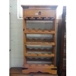 A modern pine wine rack fitted drawer,