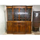 A Georgian style mahogany break front library bookcase with glazed lattice doors,