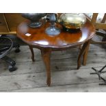 Circular mahogany coffee table on cabriole style legs