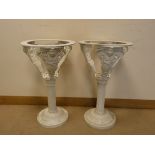 A pair of white painted cast iron figure decorated plant jardiniere's,