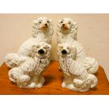 Two pairs of white Staffordshire dog ornaments