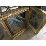 A gilt framed needlework sampler and four gilt picture frames