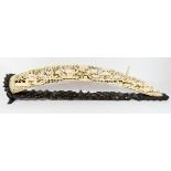 Japanese Meiji period carved ivory bridge on a hardwood stand length overall 55cms