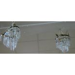 A pair of hanging lustre light fittings