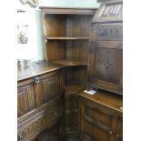 An Ercol Golden Dawn open court cabinet with cupboard under