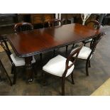 A Victorian style mahogany extending dining table, with two extra leaves,