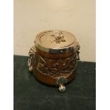 An oak biscuit barrel with carved oak leaf panels with plated lid and lion mask handles