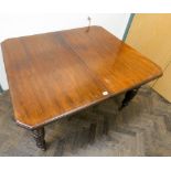 An Edwardian wind out mahogany dining table with one additional leaf on turned legs and ceramic