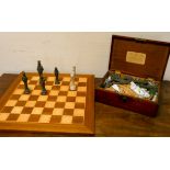 A set of Chinese design chess pieces in mahogany box and a chessboard