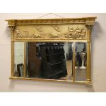 A Regency triple panel over mantel mirror in decorative gilt frame,