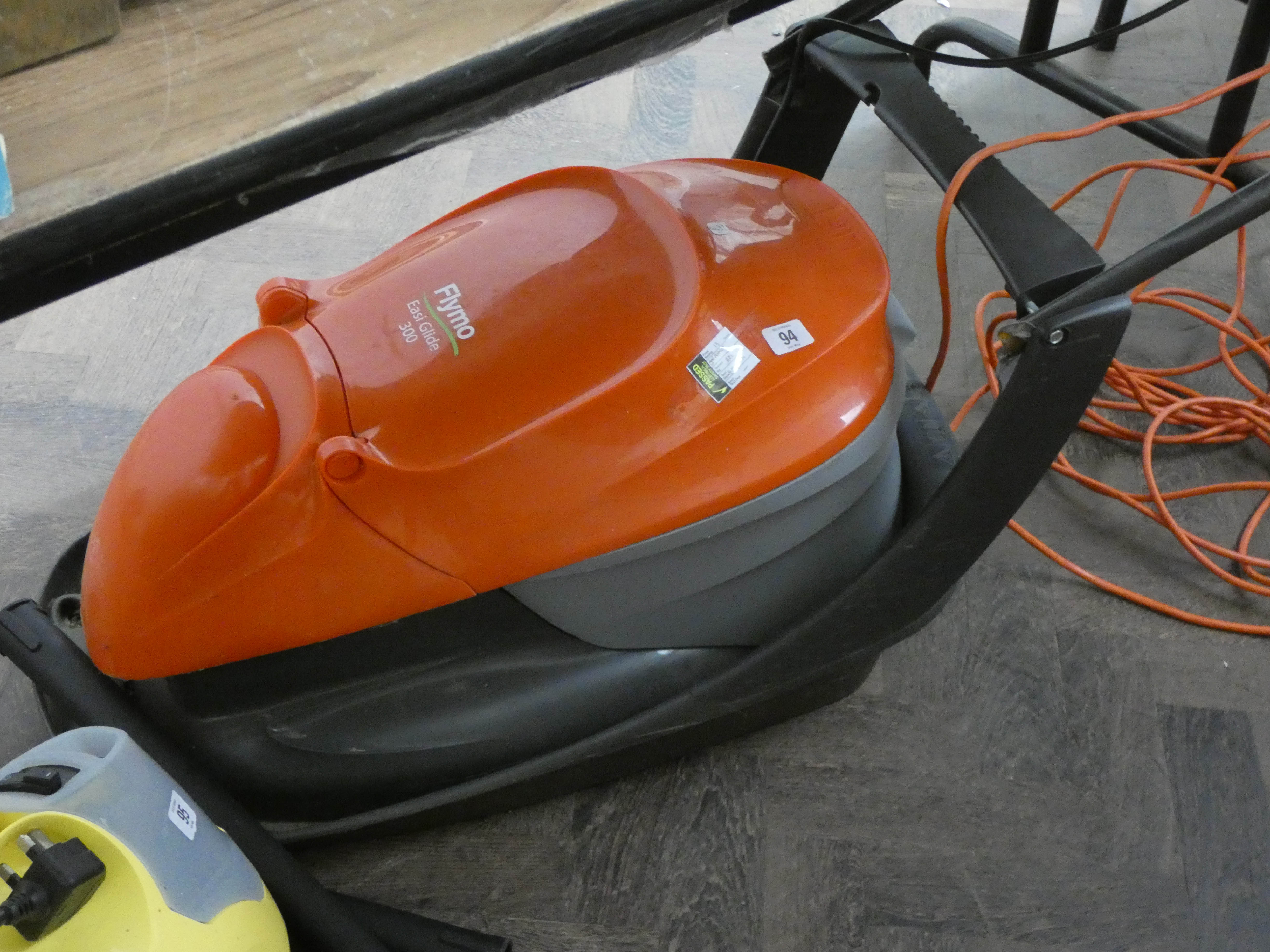 A Flymo Easy Glide electric lawn mower