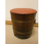 An oak brass bound barrel log tub with lift off red vinyl seat