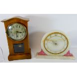 A Smiths circular onyx mantel clock and another in oak case