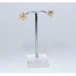 A pair of 18ct gold and diamond snowflake stud earrings