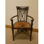 An Edwardian mahogany tub shaped elbow chair,