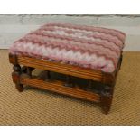 A small Edwardian walnut framed upholstered foot stool