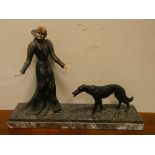 Early 20th Century French spelter decorated lady figure with hound standing on a heavy marble base,