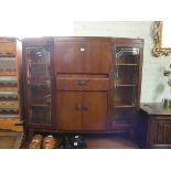 A walnut shaped front side by side bureau display cabinet,