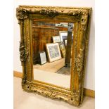 A very large Victorian bevelled wall mirror in decorative gilt frame approx 48" x 40"