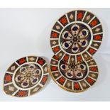 A set of six Crown Derby Imari pattern dinner plates and a shaped serving plate