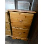A pine two drawer filing cabinet