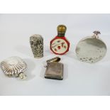 A collection of silver and white metal scent bottles,