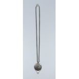 An Edwardian silver pendant with diamond dropper