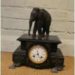 A French striking mantel clock in black marble case with elephant mount