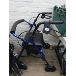 A fold up four wheeled Zimmer frame with bag,