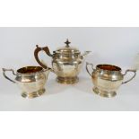 A three piece hallmarked silver tea service by Elkington & Co,