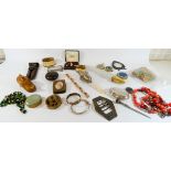 A tray of interesting collectibles to include snuff shoes, scent bottles,