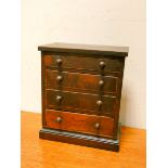 A miniature Victorian chest of four drawers,