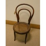 A child's Bentwood chair with cane seat