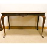A mahogany serving or silver table standing on cabriole legs with blind fret work style frieze
