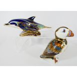 Two Royal Crown Derby paperweights to include puffin and bottle nosed dolphin