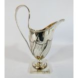Hallmarked silver helmet shaped cream jug, Birmingham hallmarks 1891, height 14cms,
