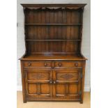 A good quality reproduction oak Welsh style dresser with shelf back drawers and cupboards under,