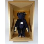 A 1998 blue Steiff jointed Teddy Bear with box and certificate, dark blue,