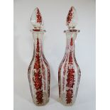 A pair of Victorian Bohemian ruby flash glass liquor decanters,