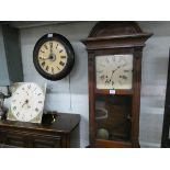 A postman's style circular wall clock and a grandfather clock movement with painted dial and a