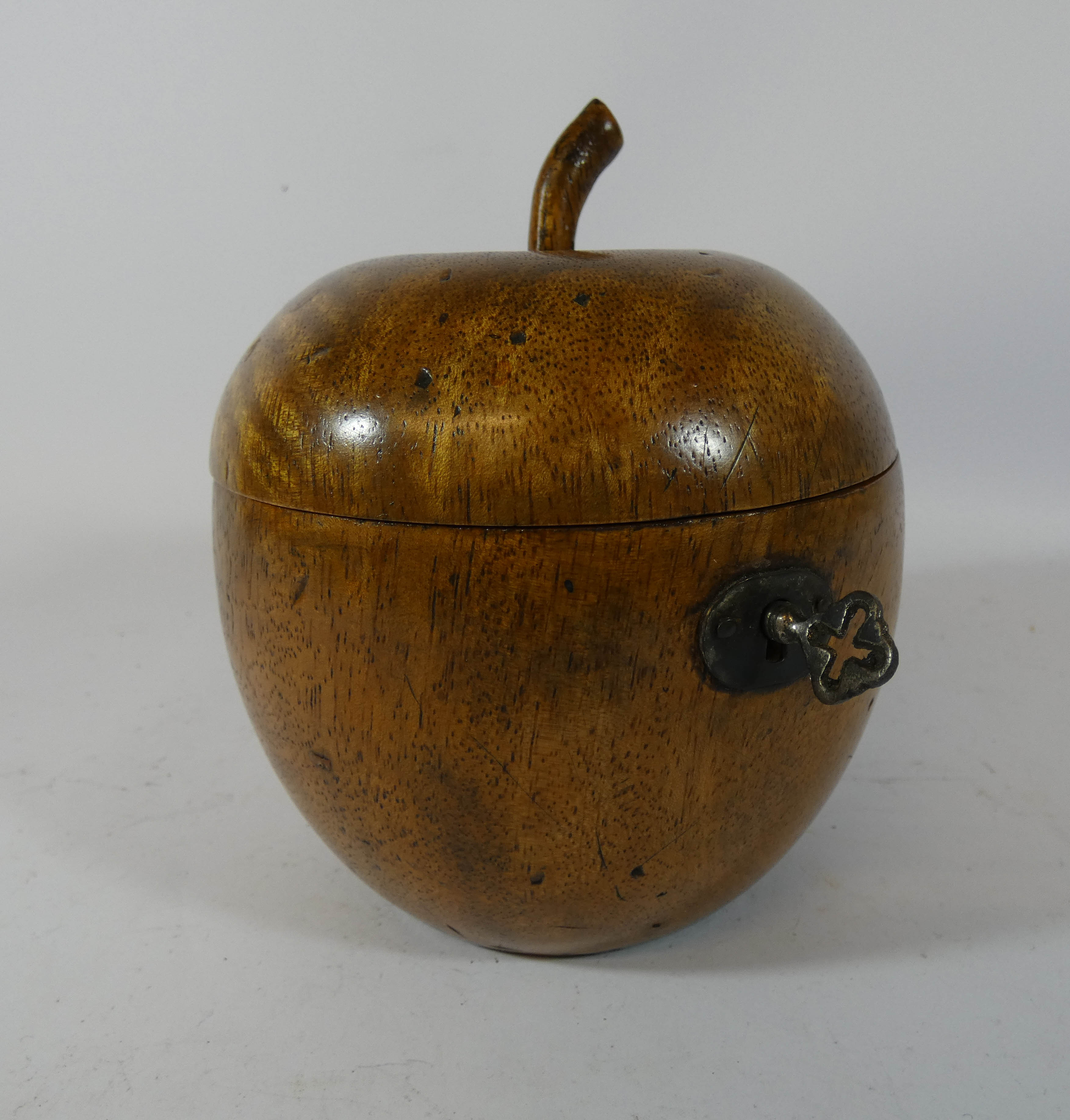 A Georgian style fruitwood apple shaped tea caddy 14cms tall