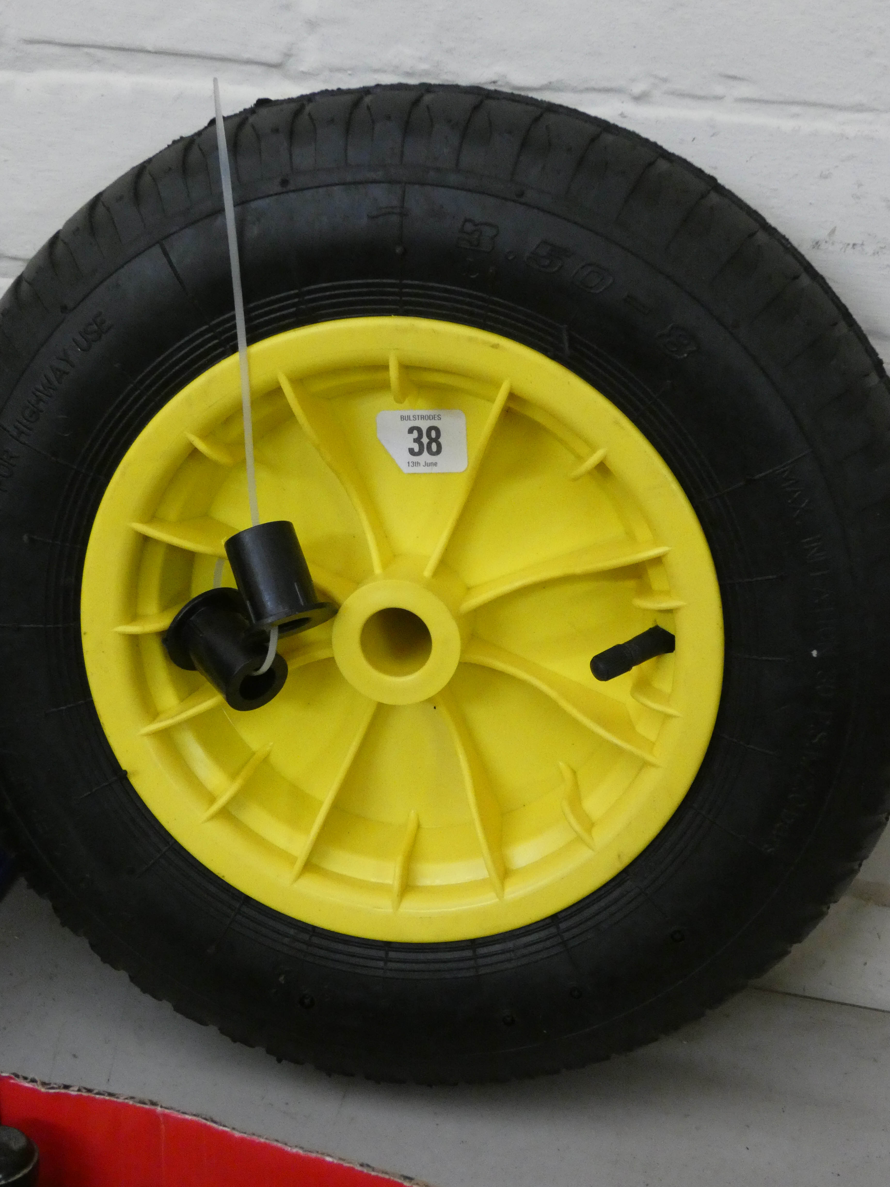 A new wheelbarrow wheel with Numatic tyre and two spacers