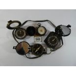 Three various military compasses,