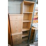 A pair of light pine effect four drawer bedside chests and a tall open bookshelf