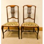 A pair of Edwardian inlaid mahogany occasional chairs with upholstered seats